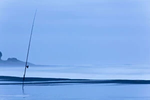 Fishing rod on the beach at dusk, Oakura, Taranaki Region, New Zealand