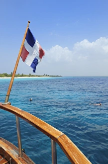 Ensign Gallery: Flag of the Dominican Republic at the stern of a sailing ship, Dominican Republic, Caribbean
