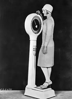 Flapper Weighing Herself on Scale