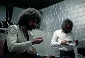 Prints of JULY 1977: Guitarist Lindsey Buckingham and bassist John McVie of the rock group Fleetwood Mac warm up backstage in July 1977. (Photo by Michael Ochs Archives/Getty Images) Go Your Own Way: A Visual Celebration of Rock’s Most Enchanting and Enduring Band: Fleetwood Mac Backstage