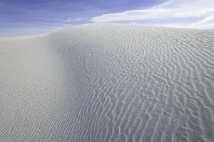 Flowing patterns and shapes created by wind on white gypsum sand dunes