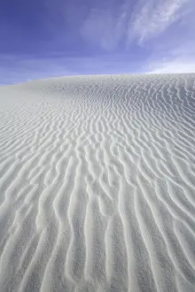 Flowing patterns and shapes created by wind on white gypsum sand dunes