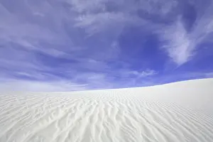 Flowing patterns and shapes created by wind on white gypsum sand dunes