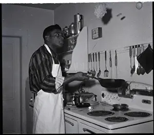 Floyd Patterson Flips Pancake in Kitchen