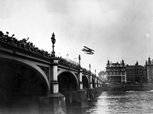 Biplane Collection: Flying Over Bridge