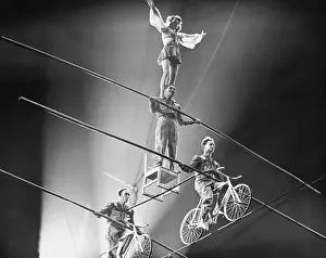 Bicycling Prints: Flying Wallendas Performing High Wire Act