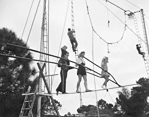 Balancing Prints: Flying Wallendas on Tightrope
