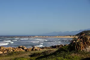 Images Dated 13th May 2017: Foamy waves roll over rugged rocks and onto the sandy beach at Buffalo Bay (aka Buffelsbaai)