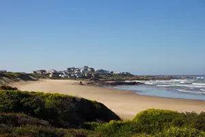 Dunes Prints: Foamy waves roll over rugged rocks and onto the sandy beach at Buffalo Bay (aka Buffelsbaai)
