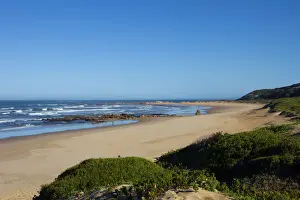 Dunes Prints: Foamy waves roll over rugged rocks and onto the sandy beach at Buffalo Bay (aka Buffelsbaai)