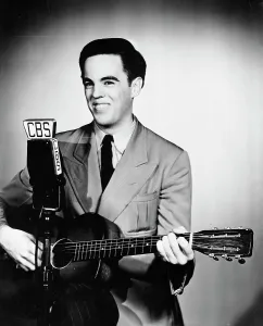 Folk Music Prints: Folk Song Entertainer Alan Lomax with His Guitar