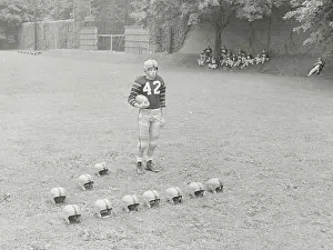 Richard W Prints: Football Player with Helmets