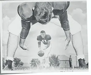 Norman Prints: Football Player Passing Ball to Teammate