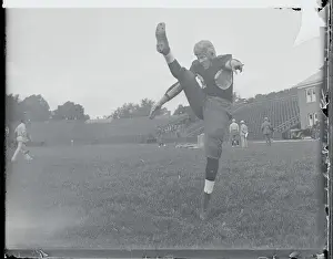 Princeton Prints: Football Player Practicing His Kicking