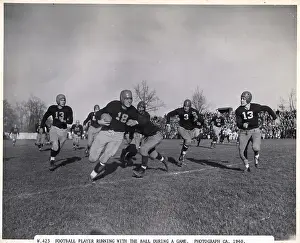 Chasing Prints: Football Player Running With Ball