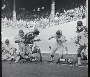 Football Player Tackling Opponent