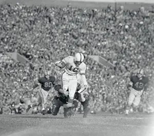 Football Player Tackling His Opponent