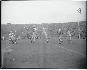 New Haven Prints: Football Players Leaping for a Pass