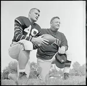 Football Players Pausing on the Field