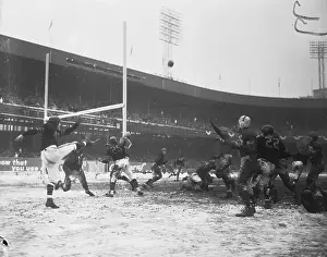 Football Players Playing Near Football Goal