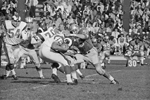Football Players in Rigorous Action
