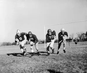 Garden City Prints: Football Players Running on Field