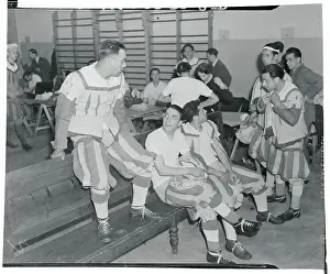 Football Players Sitting Down