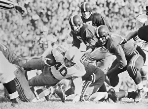 Madison Prints: Football Players Tackling Howard Cassady
