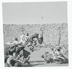 Ann Arbor Prints: Football Players Tackling Their Opponent