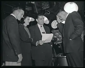 Football Players at TV Set
