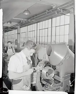 Dearborn Prints: Ford Employee Examining Machinery