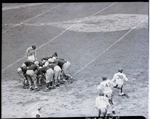 Fordham Fotball Team In A Huddle