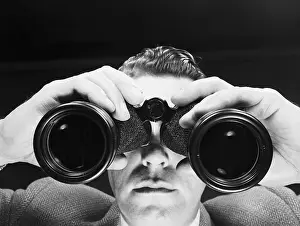 Binoculars Prints: Foreshortened View of a Man Looking Through Binoculars