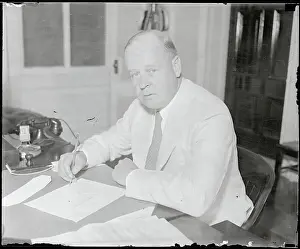 Frank C Prints: Frank C. Walker Sitting at Desk