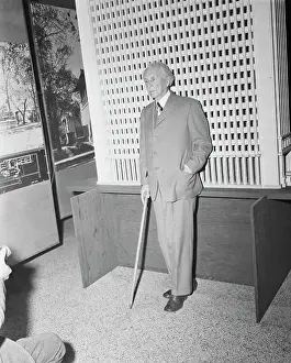 Frank Lloyd Wright Standing by Model Skyscraper