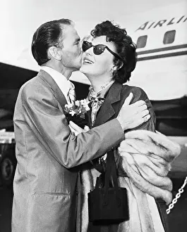 John F Prints: Frank Sinatra Kissing Wife Ava Gardener