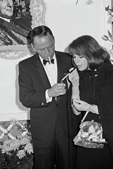 Prints of American singer Frank Sinatra lighting actress Natalie Wood's cigarette at the premiere of My Fair Lady in Los Angeles on October 28th, 1964. (Photo by Graphic House/Getty Images) Grace, Glamour & Timeless Elegance: Frank Sinatra And Natalie Wood Smoking At A Film Premiere