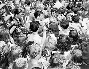 Autographing Prints: Frank Sinatra Surrounded By His Fans