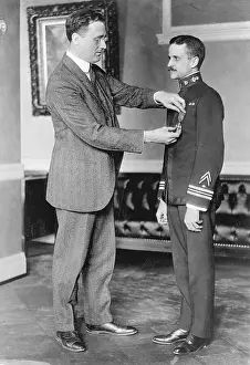 Franklin D Prints: Franklin D. Roosevelt Pins Medal of Honor on Lieutenant Commander Joel T. Boone