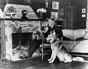 Franklin D Prints: Franklin D. Roosevelt Reading with Dog