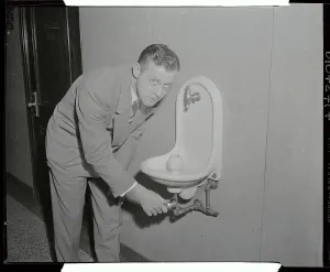 Thirst Prints: Fred Drenkhan Leaning over Water Fountain