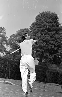 Prints of 23rd July 1949: English tennis star Fred Perry (1909 - 1995), the first player ever to win all four major singles titles demonstrates a backhand volley on court A Photographic Legacy: Fred Perry