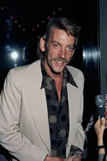 Prints of Canadian actor Donald Sutherland, wearing a beige suit, attends an FTA (Free The Army) event, United States, August 1972 Vietnam War Prints: Free The Army Event, August 1972