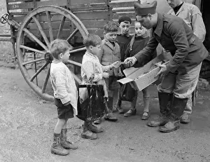 Receiving Prints: French Children Receiving Cookies, Wwii
