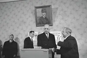 French President Charles de Gaulle prepares to vote