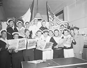 French Servicemen Read About D-Day