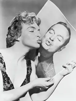 French Singer Line Renaud Kissing Photo of Bob Hope