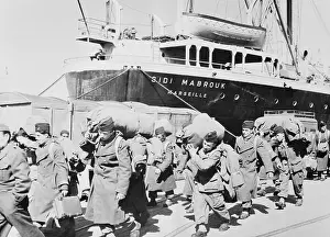 French Soldiers Walking Off of Their Ship