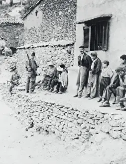 Algeria Prints: French Troops and Arabs Conversing on Village Wall