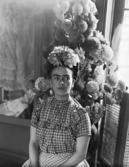 Frida Kahlo Sitting Underneath Flower Arrangement